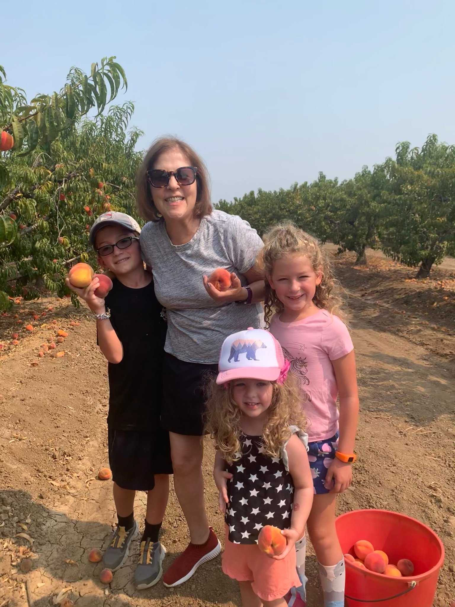 Meryl Wiernik Peach Picking with Grandkids